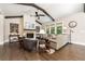 Comfortable living room featuring a fireplace, hardwood floors, and cozy seating arrangement at 427 Parkbrook Way, Canton, GA 30114