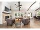 Inviting living room with a brick fireplace, hardwood floors, and ample natural light at 427 Parkbrook Way, Canton, GA 30114