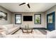 Neutral living room with hardwood floors, gray walls, light sofa, blue trim, and back door at 427 Parkbrook Way, Canton, GA 30114