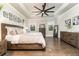 Large main bedroom with tray ceiling, ceiling fan, hardwood floors, and natural light at 427 Parkbrook Way, Canton, GA 30114