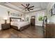 Spacious main bedroom with modern furniture, hardwood flooring, and decor at 427 Parkbrook Way, Canton, GA 30114