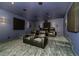 Luxurious home theater features tiered seating, ambient lighting, and surround sound speakers at 427 Parkbrook Way, Canton, GA 30114