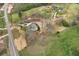 Aerial view of property showing driveway, landscaping and surrounding acreage at 6110 Harvest Way, Cumming, GA 30028