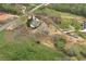 Aerial view of property showing driveway, landscaping and surrounding acreage at 6110 Harvest Way, Cumming, GA 30028