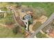 Aerial shot of a house on a large lot with winding drive and professionally landscaped front yard at 6110 Harvest Way, Cumming, GA 30028