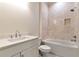 Bathroom with vanity, soaking tub and shower with tan tiles at 6110 Harvest Way, Cumming, GA 30028