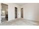 Spacious bedroom featuring neutral walls and trim, an ensuite and walk-in closet at 6110 Harvest Way, Cumming, GA 30028