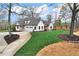 Stunning white home with an attached two car garage and circular driveway at 6110 Harvest Way, Cumming, GA 30028