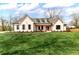 Charming white brick home featuring a manicured lawn and welcoming front porch at 6110 Harvest Way, Cumming, GA 30028