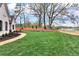 Expansive front yard with lush green grass and a curving walkway leading to the entrance at 6110 Harvest Way, Cumming, GA 30028