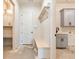 Mudroom featuring built-in bench with hooks, gray cabinets, and a utility sink at 6110 Harvest Way, Cumming, GA 30028