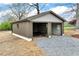 Detached garage or outbuilding with gravel and matching trim at 6110 Harvest Way, Cumming, GA 30028