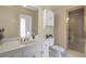 Bathroom featuring a large countertop, walk-in shower, and white cabinets at 2885 Coles Way, Atlanta, GA 30350