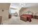 Spacious bedroom with a large bed, comfortable seating, and a stylish cabinet at 2885 Coles Way, Atlanta, GA 30350