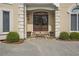 Close-up of the home's impressive front entrance with double doors and stone accents at 2885 Coles Way, Atlanta, GA 30350