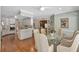 Bright dining area and open kitchen space, featuring hardwood floors at 2885 Coles Way, Atlanta, GA 30350
