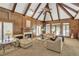Cozy living room with wood paneled walls, fireplace, and comfortable seating at 2885 Coles Way, Atlanta, GA 30350