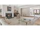 Elegant living room features a fireplace with marble surround and glass coffee table at 2885 Coles Way, Atlanta, GA 30350