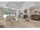 Bright living room with large windows, a fireplace, and access to the backyard at 2885 Coles Way, Atlanta, GA 30350