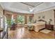 Serene main bedroom with hardwood floors, large windows, and tray ceiling at 2885 Coles Way, Atlanta, GA 30350