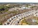 Aerial view of a neighborhood showcasing well-maintained homes and landscaping with a wooded backdrop at 311 Ivy Chase Loop, Dallas, GA 30157