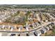 A high aerial view shows the property situated in a vibrant residential area with lush greenery at 311 Ivy Chase Loop, Dallas, GA 30157
