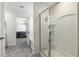 Clean, bright bathroom featuring shower with glass door and view of connected bedroom at 311 Ivy Chase Loop, Dallas, GA 30157