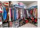 Spacious walk-in closet with organized shelves, rods, and plenty of room for storage at 311 Ivy Chase Loop, Dallas, GA 30157