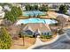 A clubhouse with a pool, tennis courts, and lush landscaping enhancing the community's appeal at 311 Ivy Chase Loop, Dallas, GA 30157
