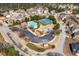 Aerial view of community amenities featuring a pool, tennis courts, playground, and ample parking at 311 Ivy Chase Loop, Dallas, GA 30157