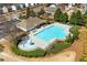 Aerial view of a community pool with lounge chairs and a splash pad, perfect for residents' relaxation at 311 Ivy Chase Loop, Dallas, GA 30157