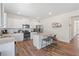 Spacious kitchen with granite countertops, stainless steel appliances, and wood flooring at 311 Ivy Chase Loop, Dallas, GA 30157