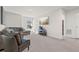 Upstairs living room with couch, TV, and neutral carpet at 311 Ivy Chase Loop, Dallas, GA 30157
