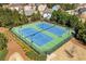 Aerial view of the community tennis courts in a well-maintained neighborhood; fun and fitness at 311 Ivy Chase Loop, Dallas, GA 30157