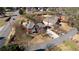Beautiful aerial view of a two-story brick home, landscaped yard, and tree-lined street at 5289 Browning Sw Way, Lilburn, GA 30047