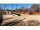 Spacious backyard features a basketball court, storage shed, and privacy fence at 5289 Browning Sw Way, Lilburn, GA 30047
