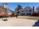 Spacious backyard featuring a basketball court, lawn and a classic two-story home with neutral siding at 5289 Browning Sw Way, Lilburn, GA 30047