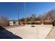 Backyard shot of cement pad with basketball hoop and storage shed at 5289 Browning Sw Way, Lilburn, GA 30047