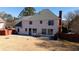 Expansive backyard with a well-manicured lawn, featuring a patio area perfect for entertaining and relaxation at 5289 Browning Sw Way, Lilburn, GA 30047