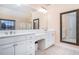 Bathroom featuring double sinks and framed mirrors at 5289 Browning Sw Way, Lilburn, GA 30047