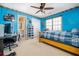 Bedroom with blue walls featuring a bed and view into the bathroom at 5289 Browning Sw Way, Lilburn, GA 30047