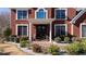 Close up front entry with well manicured lawn and landscape at 5289 Browning Sw Way, Lilburn, GA 30047