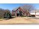 Lovely two-story red brick house with manicured front yard, a blend of classic style and comfort at 5289 Browning Sw Way, Lilburn, GA 30047