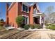 Charming brick two-story home with well-maintained landscaping, columned front porch, and inviting curb appeal at 5289 Browning Sw Way, Lilburn, GA 30047