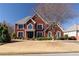 Beautiful two-story home with classic architectural details and a neatly maintained front yard at 5289 Browning Sw Way, Lilburn, GA 30047