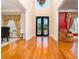 Inviting foyer with hardwood floors, ornate front door, and architectural details at 5289 Browning Sw Way, Lilburn, GA 30047