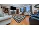 Comfortable living room featuring a fireplace, built-in shelving, and hardwood floors at 5289 Browning Sw Way, Lilburn, GA 30047