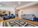 Open-concept living area with hardwood floors, comfortable seating, and lots of space at 5289 Browning Sw Way, Lilburn, GA 30047