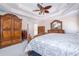 Well-lit main bedroom featuring hardwood furnishings, and a ceiling fan at 5289 Browning Sw Way, Lilburn, GA 30047