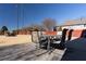 Backyard patio features an outdoor dining set, storage, and a spacious yard perfect for entertaining at 5289 Browning Sw Way, Lilburn, GA 30047